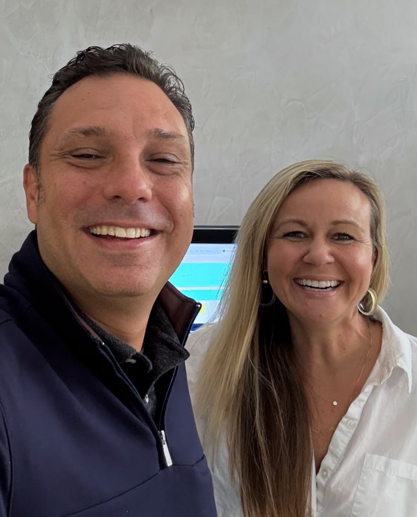 Felipe Ramirez and Amber Tollefson smiling together at The Flamingo House