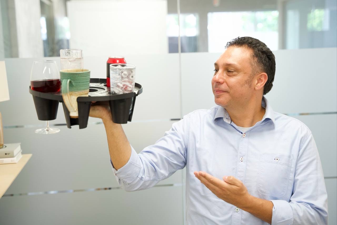 Felipe Ramirez, inventor and founder of GrippyTray, presenting the final round tray design