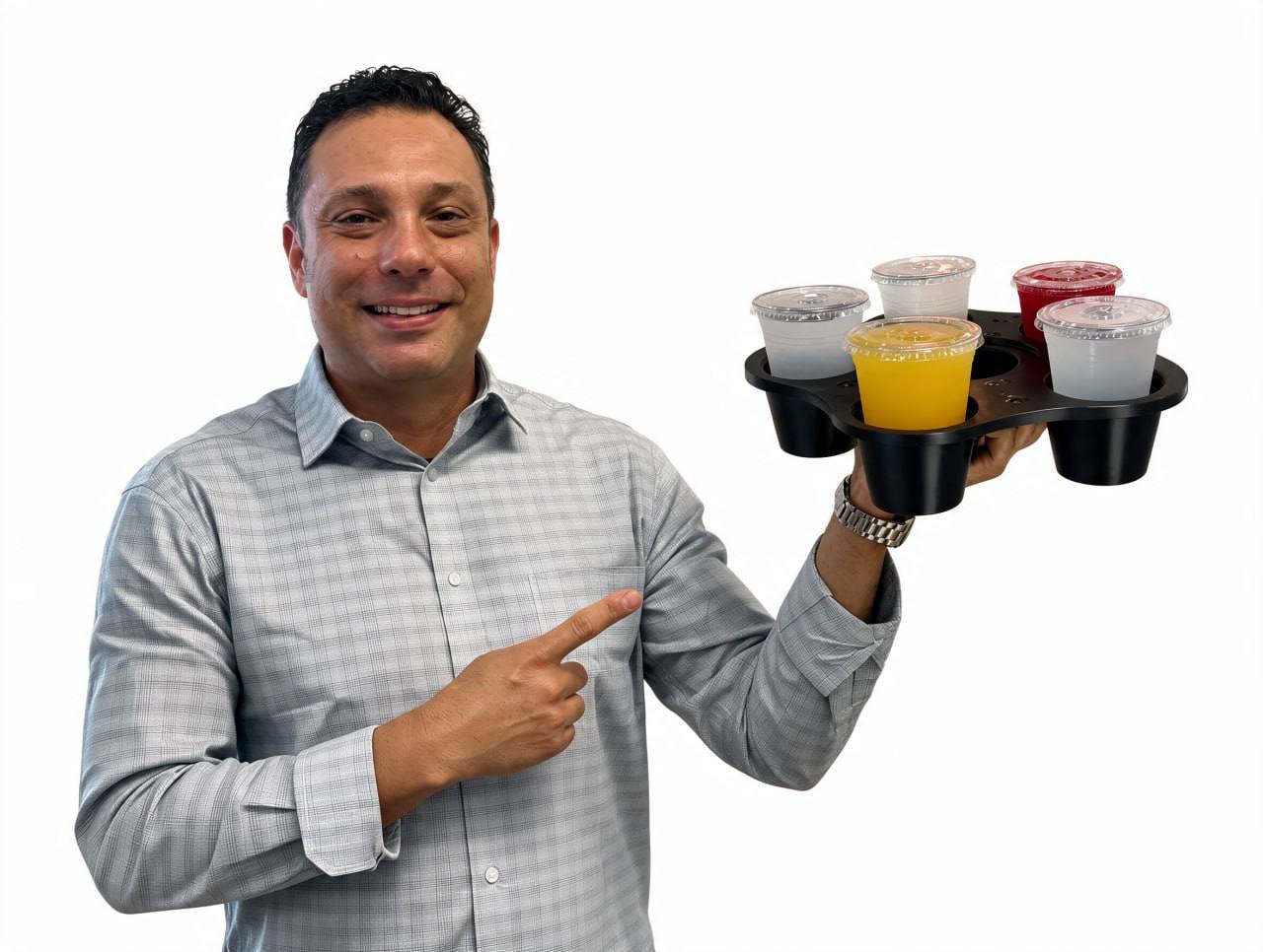 Felipe Ramirez, inventor and founder of GrippyTray, holding an early tray prototype