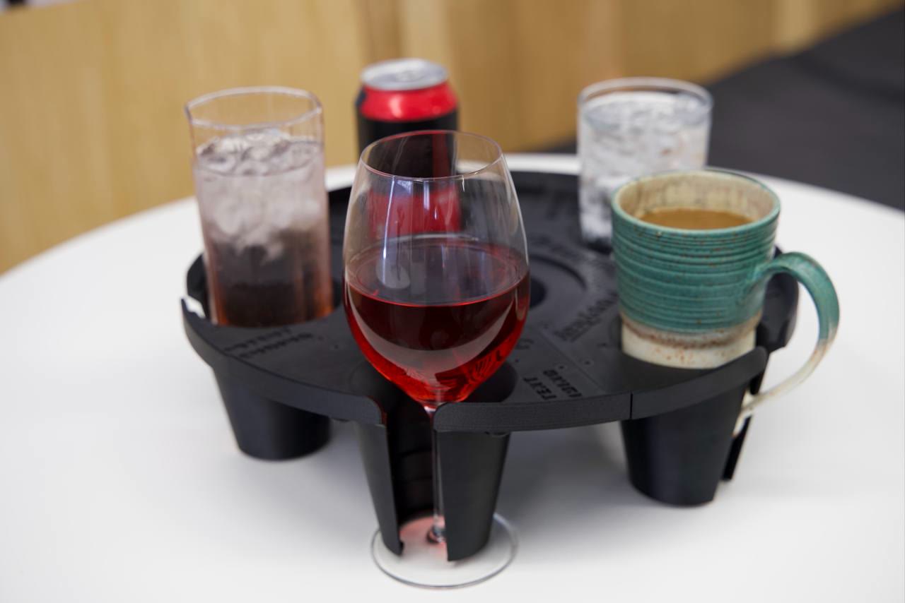 Angled view of the final round GrippyTray showing its protective lip and stepped cup supports